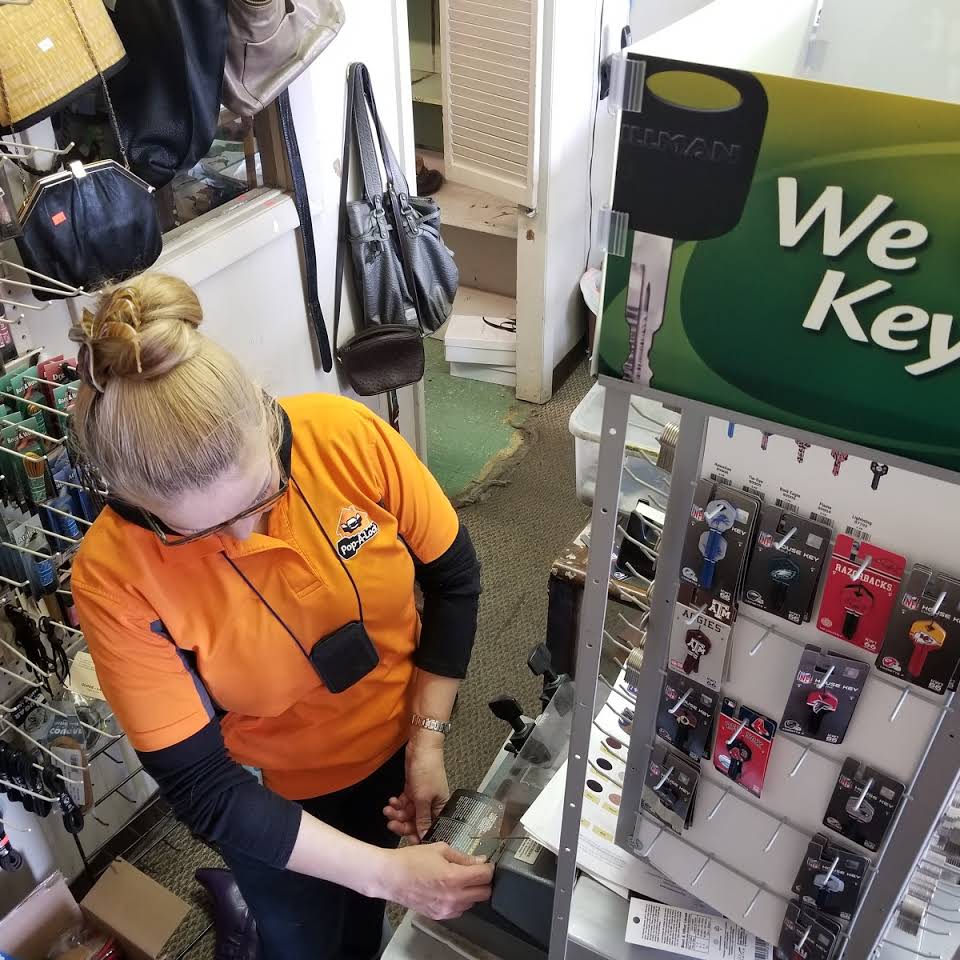 Pop-A-Lock team member preparing keys at the local key center